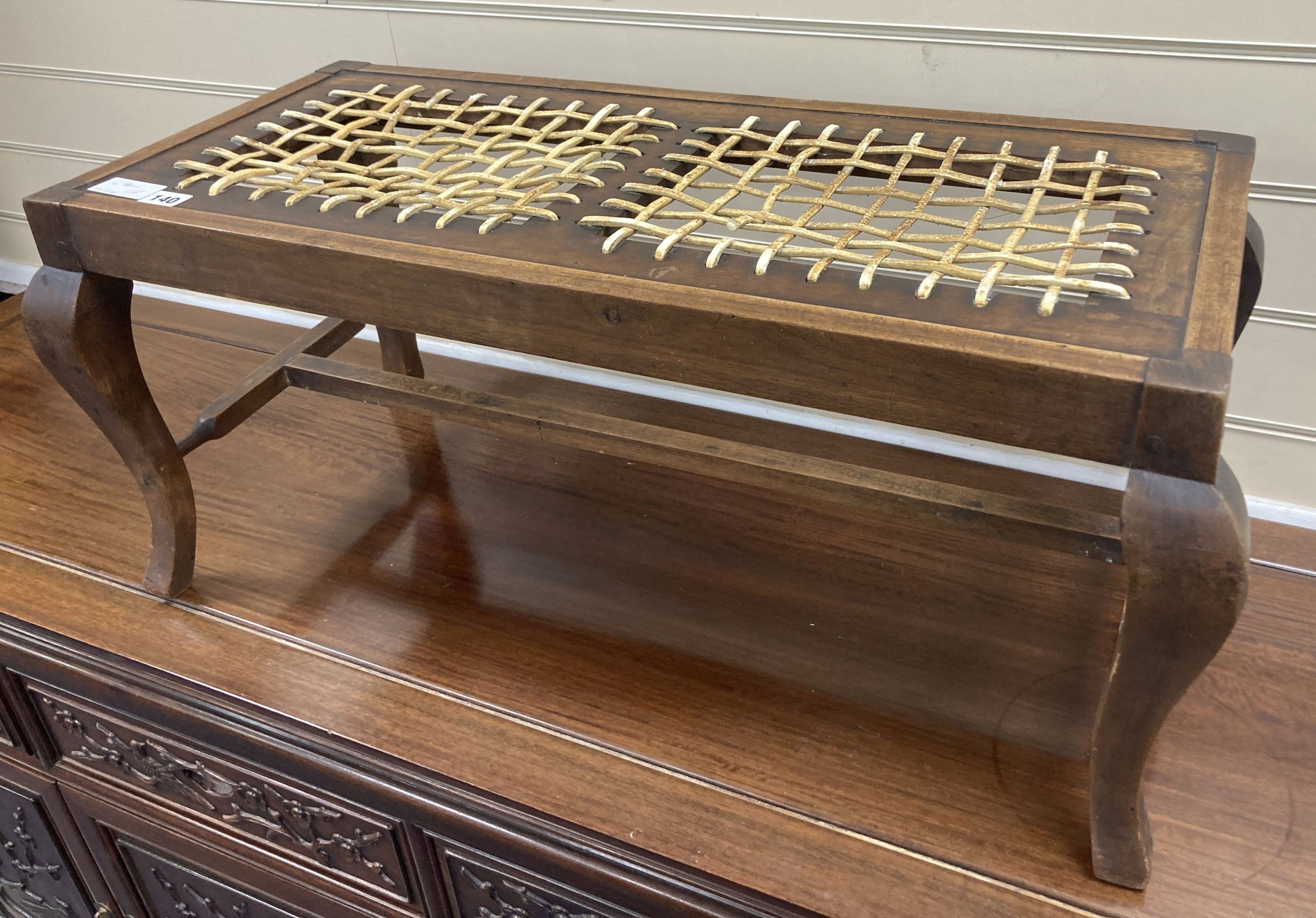 An early 20th century mahogany framed luggage stool with woven strapwork top, 35cm high, width 76cm, depth 34cm